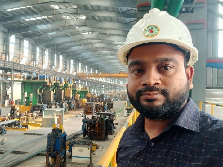 Inside the new rolling mill hall — roller tables and cable carriers before commissioning